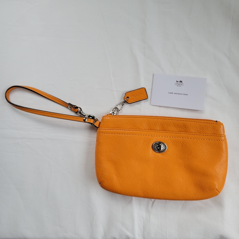Brand new Coach wristlet pumpkin orange leather!